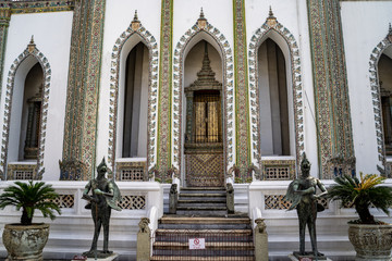 Detailed and ornate doorway views of temple at the Grand Palace in Bangkok Thailand