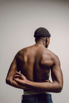 Rear view of muscular shirtless model