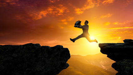 Businessman jump over leap. Mixed media