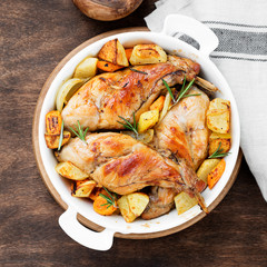 Stewed in white wine with spices rabbit legs with baked vegetables and rosemary.