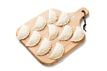 Homemade raw dumpling with potatoes. Preparation dumplings with mashed potatoes . isolated on white...