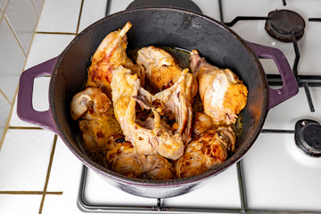 Sliced ​​rabbit stew in a brazier.