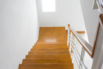 Wooden stairs in the house, looking down.