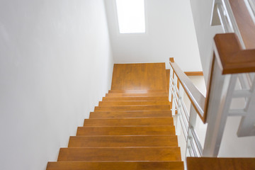 Wooden stairs in the house, looking down.