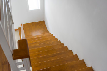 Wooden stairs in the house, looking down.