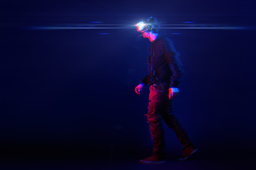 Fototapeta na wymiar Man with virtual reality headset. Image with glitch effect