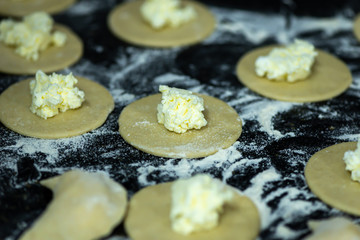 Raw dumplings or vareniks, traditional Russian and Ukrainian food,