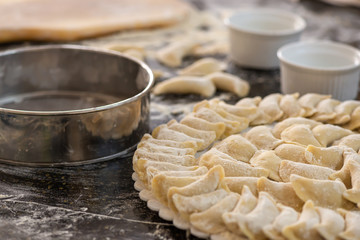 Raw dumplings or vareniks, traditional Russian and Ukrainian food,