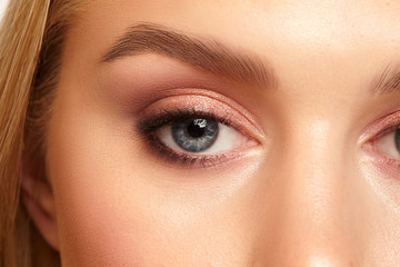  close-up eye with clean skin with natural makeup