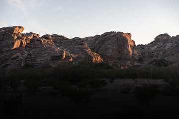 Rocks lit up during sunset at Hueco Tanks, Texas. 