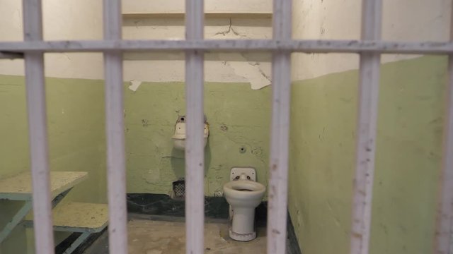 Metal iron prison jail gaol cell bars locked up punishment justice B-roll 