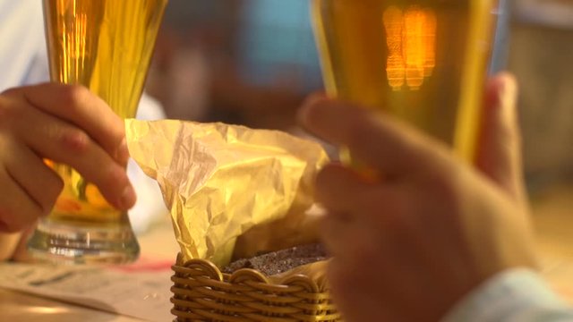Stock video footage series clink glasses beer garden