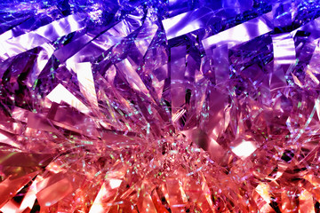 Bright christmas background with colored tinsel