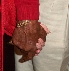 hands of man and woman holding hands