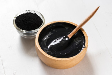 Homemade skin remedies and facial care, activated black charcoal and yogurt mask, cosmetic product