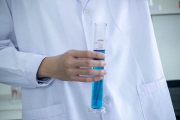 Fototapeta premium The concept of medical, chemicals or scientific laboratory research and Innovation in the laboratory. experienced man scientist is performing work in the laboratory..
