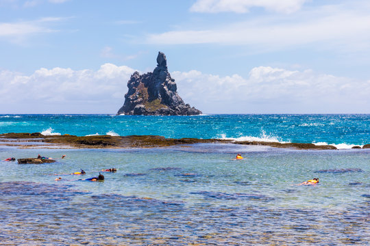 Beautiful view of Atalaia's natural pool and Morro do Frade in Fernando de Noronha, Brazil. It can be accessed by an easy trail with an incredible view and a unforgettable swim in the natural pool.