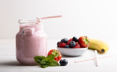 Red fruit smoothie. On a white background