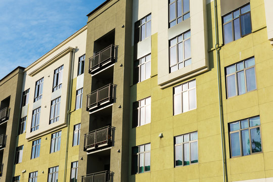 Exterior View Of Typical Multifamily Mid-rise Residential Building Used Rental Apartments, College Dorms, Condominiums.