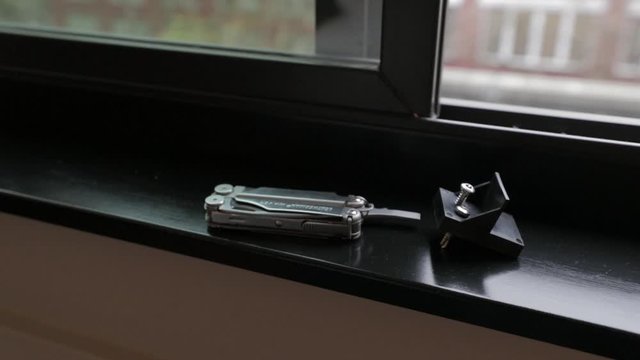 plier multi function tool on window sill