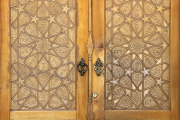 A wooden door made of handicraft