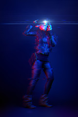 Fototapeta na wymiar Woman wearing virtual reality headset. Image with glitch effect