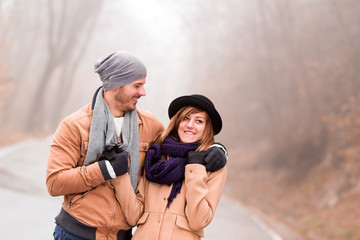 Couple enjoying outdoors in cold autumn / winter time.