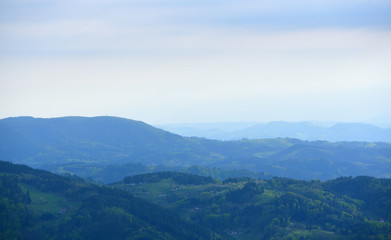 Fototapeta na wymiar Picturesque landscape with hills and blue air, the atmosphere in the European forest of Schwarzwald,, Germany. Clean Air Ecology Concept