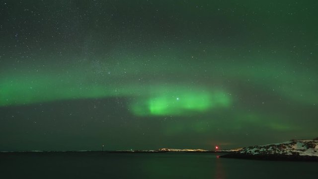 Time lapse of northern lights (aurora borealis) over skerries in Tr&aelig;na archipelago, Nordland, Norway