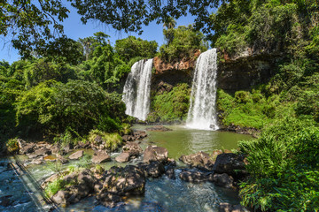 Famous Iguazu waterfalls with beautiful clouds. Declared a World heritage and one of the seven Natural Wonders of the World  Salto Dos Hermanos /Two Brothers waterfall on Iguazu falls Brasil Argentina