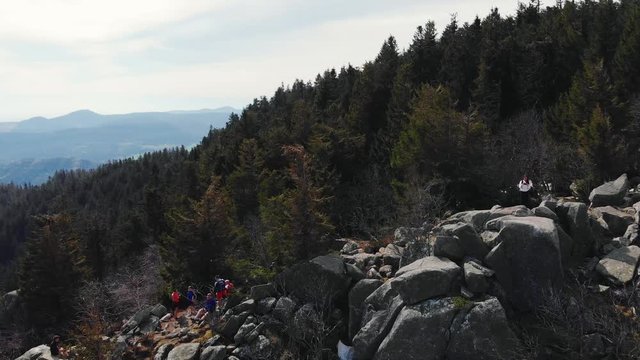 4K Drone Video Aerial View of French Mountains, trees and hikers rock climbing in Vosges / Alsace, France during a summer trip.