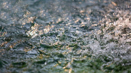 Abstract image of water splash from fountain or rain.