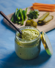 Homemade creamy hummus in a jar