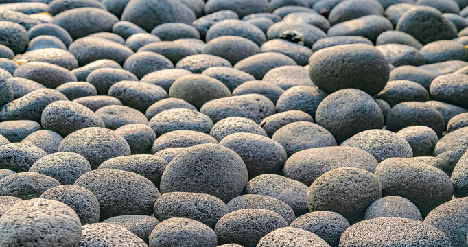 Abstract smooth round pebbles sea stone texture background