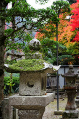 Close-up stone lantern in autumn season at Minoo park in Osaka, Japan