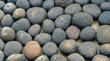 Abstract smooth round pebbles sea stone texture background