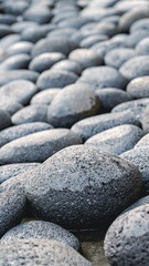 Fototapeta na wymiar Abstract smooth round pebbles sea stone texture background