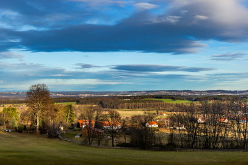 Landscape of South Bohemia with villages, forests, fields and blue sky. Czech Republic.