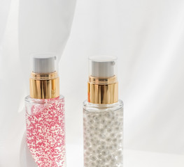 Skincare serum and make-up primer gel bottle, moisturizing lotion and lifting cream emulsion,...