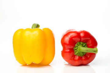 Two red and yellow Fresh pepper are isolated in  white background.