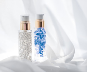 Skincare serum and make-up primer gel bottle, moisturizing lotion and lifting cream emulsion,...