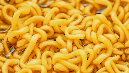 close up Noodle cup or instant noodles , noodle soup in a cup, with a view from above macro photography texture background