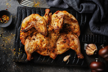 Baked chicken tabaka with spices