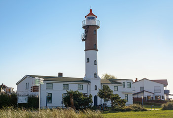 Fototapeta na wymiar Lighthouse in Timmendorf on the island of Poel near Wismar in the Baltic Sea, Germany, blue sky with copy space