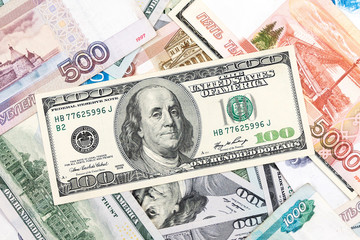 Obraz na płótnie Canvas American dollars and Russian rubles, banknotes.