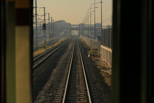 railway tracks. one point perspective view of a strait long train rail track. train path in a rural area.