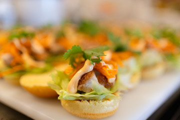 fresh crispy pork burger on white plate