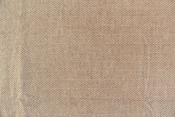 Light beige natural nepalese cashmere fabric. Herringbone tweed, Virgin Wool Background Texture. Expensive material.