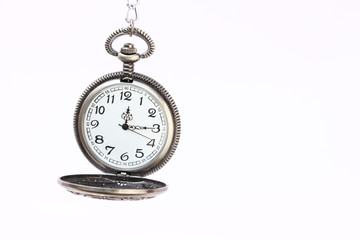 old pocket watch with chain isolated on white