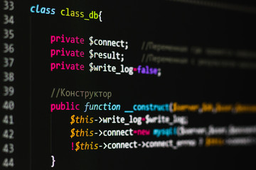 php code on a black background on the monitor
